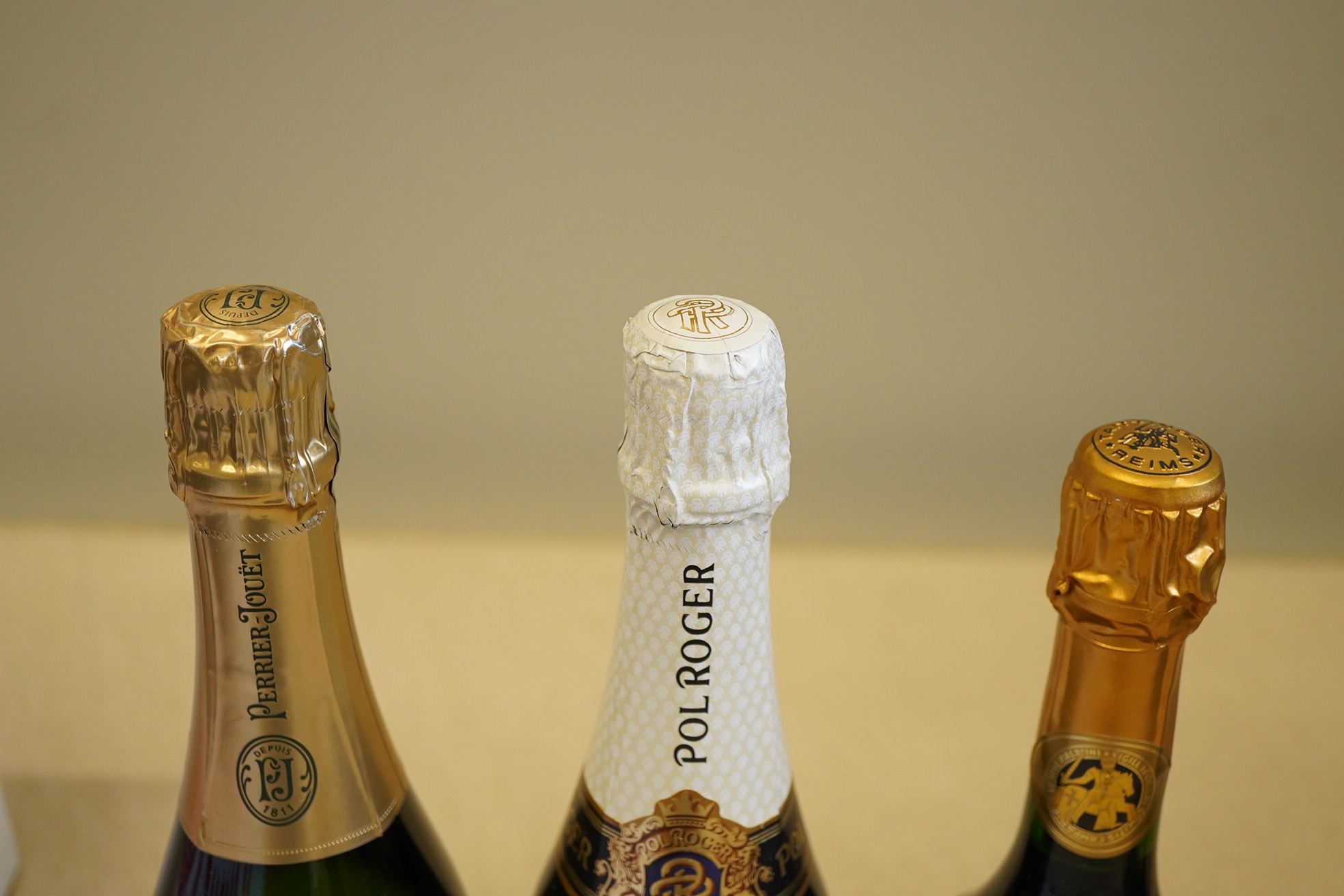 A bottle of 2007 Perrier - Jouet Belle Epoque Champagne, a bottle of Taittinger Comtes Champagne and a bottle of Pol Roger Extra Cuvee Reserve Champagne (3)